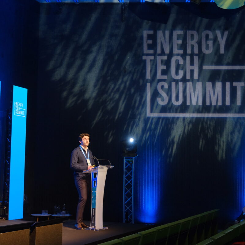 ets logo on te wall while man presents
