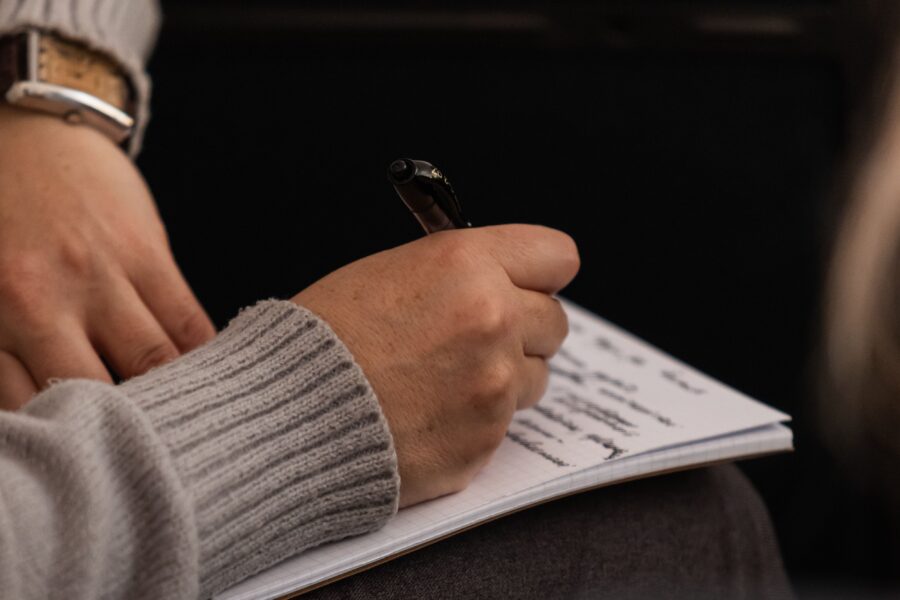 Attendee taking notes